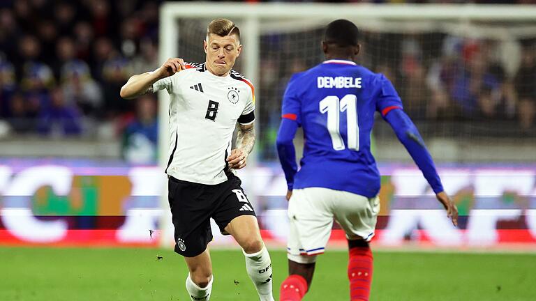 Toni Kroos (l.) - Im März 2024 feierte Kroos sein Comeback - gegen Frankreich leitete er die deutsche Führung ein. Toni Kroos (l.) - Im März 2024 feierte Kroos sein Comeback - gegen Frankreich leitete er die deutsche Führung ein.