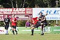 1. FC Sand II - TSV Bergrheinfeld       -  Akrobatik beim Kampf um den Ball: Der Bergrheinfelder Thomas Cäsar (rotes Trikot) im Duell mit dem Sander Kapitän Tobias Mantel.
