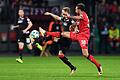 Bayer Leverkusen - 1. FC Union Berlin       -  Der Leverkusener Karim Bellarabi (r) beim Zweikampf mit Unions Simon Hedlund.