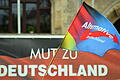 AfD in Sachsen-Anhalt.jpeg       -  Eine Fahne mit dem Parteilogo der AfD während einer Kundgebung der rechten Partei: Zuletzt machte die AfD durch besonders hohe Umfragewerte Schlagzeilen.