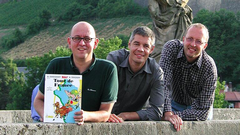 Kai Fraass, Gunther Schunk und Hans-Dieter Wolf (von links) haben den Asterix Band 'Tour de France' als 'Dour de Frångn' übersetzt. Kai Fraass, Gunther Schunk und Hans-Dieter Wolf (von links) haben den Asterix Band 'Tour de France' als 'Dour de Frångn' übersetzt.