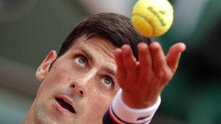 Titelverteidiger       -  Novak Djokovic hat in Paris die erste Runde souverän überstanden. Foto: Christophe Ena