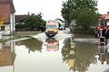 Hochwasser in Bayern - Pfaffenhofen an der Ilm       -  Ein Krankenwagen fährt über eine überschwemmte Straße in Pfaffenhofen an der Ilm.