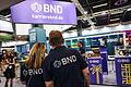 BND-Stand bei Gamescom       -  Mitarbeiter des BND stehen am Gamescom-Messestand ihrer Behörde. Die Bundesbehörde zählt circa 6.500 Beschäftigte.