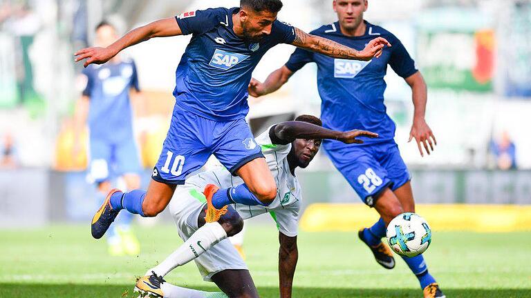 Durchgesetzt       -  Kerem Demirbays (l) Hoffenheimer setzten sich mit 1:0 gegen Lamine Sanés (M) Bremer durch.