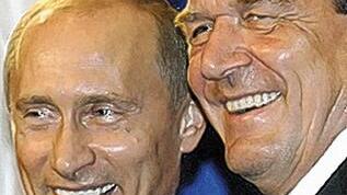 Strahlend: der damalige
Bundeskanzler Gerhard       -  Strahlend: der damalige
Bundeskanzler Gerhard Schröder und
Russlands Präsident Wladimir Putin bei
der Unterzeichnung des Vertrags
für die Ostsee-Gas-Pipeline am 9.
September in Berlin.