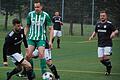 Daniel Leicht (links) vom FC Strahlungen (rechts Sebastian Braun) luchst Sebastian Heinlein (FC Untererthal) den Ball ab.