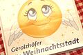 'Gine' wirb als grinsender Smiley mit Engelsflügeln für die Weihnachtsstadt Gerolzhofen.