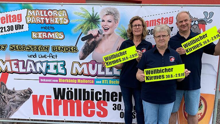 Die Wöllbicher Kirmes lockt nach Wollbach, Burkardroth. Mit dabei ist Ex-Dschungelkönigin Melanie Müller. Auf dem Foto (von links) Birgit Below, Elvira Huppmann und Matthias Wehner.   Foto: Anja Vorndran       -  Die Wöllbicher Kirmes lockt nach Wollbach, Burkardroth. Mit dabei ist Ex-Dschungelkönigin Melanie Müller. Auf dem Foto (von links) Birgit Below, Elvira Huppmann und Matthias Wehner.   Foto: Anja Vorndran