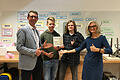 Auf dem Foto sind&nbsp; von links OStR Michael Schuster, Moritz Merkel (Q11), Nikolas Finke (Q12) und OStDin Maria Eirich zu sehen.