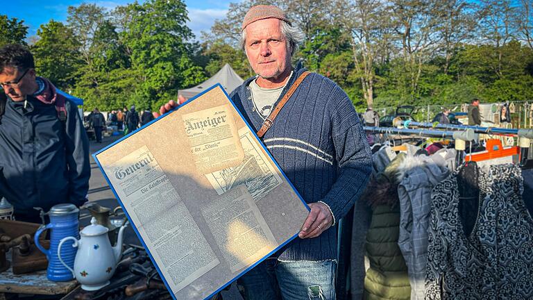 Thilo Drescher verkauft einen Zeitungsartikel von 1912 auf dem Mainwiesenflohmarkt.