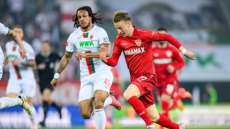 FC Augsburg - VfB Stuttgart.jpeg       -  FC Augsburg - VfB Stuttgart 10.05.2024, Bayern, Augsburg: Fußball: Bundesliga, FC Augsburg - VfB Stuttgart, 33. Spieltag, WWK-Arena. Stuttgarts Chris Führich (r) in Aktion gegen Augsburgs Kevin Mbabu (l). Foto: Tom Weller/dpa - WICHTIGER HINWEIS: Gemäß den Vorgaben der DFL Deutsche Fußball Liga bzw. des DFB Deutscher Fußball-Bund ist es untersagt, in dem Stadion und/oder vom Spiel angefertigte Fotoaufnahmen in Form von Sequenzbildern und/oder videoähnlichen Fotostrecken zu verwerten bzw. verwerten zu lassen. +++ dpa-Bildfunk +++