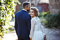 Young couple enjoying romantic moments while walking in the park in the sun.       -  In Corona-Zeiten entscheiden sich immer mehr Brautpaare für eine intime Hochzeit zu zweit.