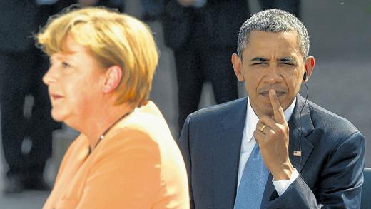 Angela Merkel und Barack Obama: Archivfoto von einer Veranstaltung am Brandenburger Tor in Berlin bei Obamas Deutschlandbesuch im Juni.