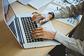 newsletter concept Hand of businessman checking message box on digital laptop Vintage tone filter.Top view       -  Symbolbild: Laptop