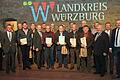 Gruppenfoto mit den Geehrten für 25 Jahre aktiven Dienst als 'Siebener'.