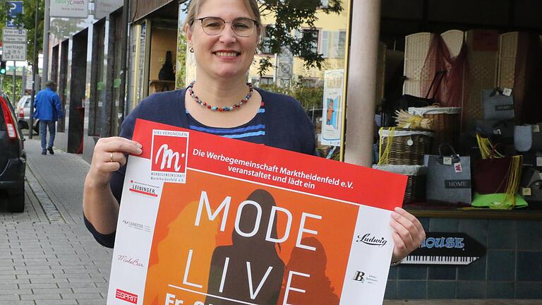 Géraldine Barrois, die Vorsitzende der Werbegmeinschaft Marktheidenfeld, präsentiert das Plakat zur Modenschau "Mode Live" am 4. Oktober. Géraldine Barrois, die Vorsitzende der Werbegmeinschaft Marktheidenfeld, präsentiert das Plakat zur Modenschau "Mode Live" am 4. Oktober.