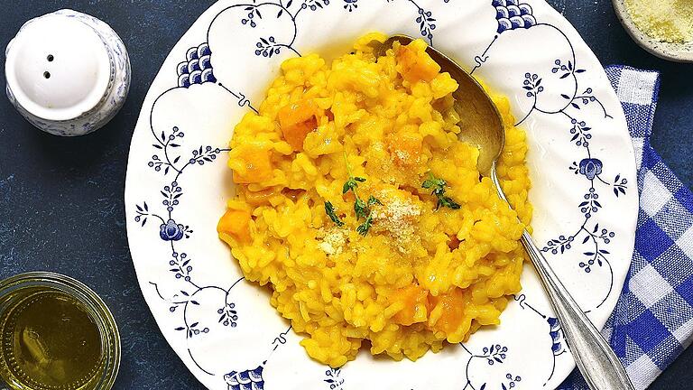 Spicy pumpkin risotto with garlic,thyme and parmesan cheese       -  Es muss nicht immer Suppe sein: Kürbis macht sich auch gut im Risotto.