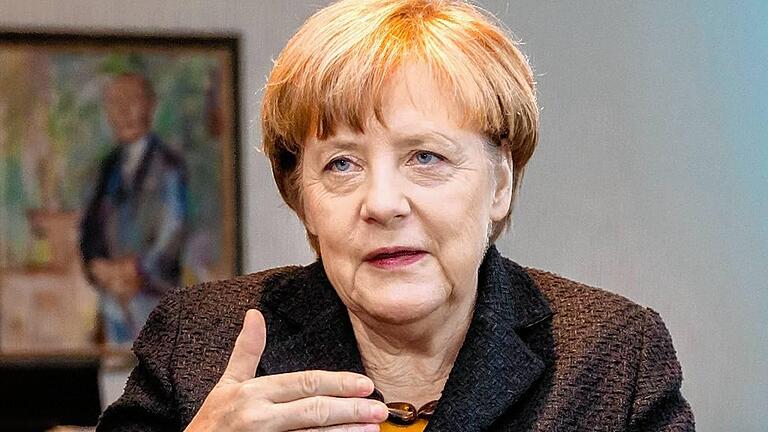 Interview Angela Merkel, Bundeskanzlerin und  Vorsitzenden der CDU Deutschlands       -  In der eigenen Partei rumort es, ihre Umfragewerte sind gesunken: Bundeskanzlerin Angela Merkel bleibt in der Flüchtlingskrise trotzdem optimistisch.