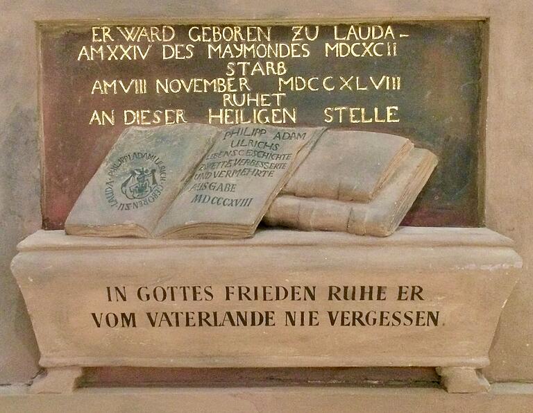 Die Anregung zur Anbringung der Gedenktafel in der Peterkirche kam von Franz Oberthür. Dessen Ulrich-Biographie ist am Fuß der Tafel dargestellt.