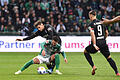 Werder Bremen - FC Augsburg.jpeg       -  Werders Leonardo Bittencourt kämpft gegen Augsburgs Elvis Rexhbecaj und Ermedin Demirovic (rechts) um den Ball.
