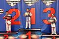 In der Bildmitte: Karateka Daniel Eckerdt von der TG Schweinfurt mit der Goldmedaille und Siegerzertifikat.