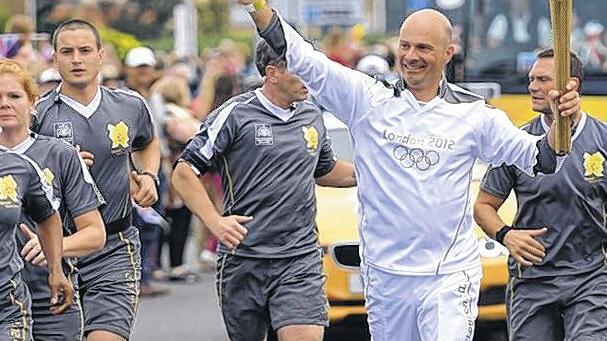 Unvergesslich: Marcel Tully trägt die Olympische Fackel ein Stück auf ihrem Weg nach London. Unvergesslich: Marcel Tully trägt die Olympische Fackel ein Stück auf ihrem Weg nach London.