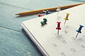 close up of calendar on the table, planning for business meeting or travel planning concept       -  Symbolbild: Kalender