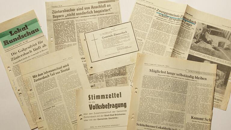 Zeitungsausschnitte aus den 1970er-Jahren zeigen, wie kontrovers die Zugehörigkeit von Züntersbach zu Hessen oder Bayern auch im Ort selbst diskutiert wurde. Am Ende ging der Ort in der Großgemeinde Sinntal auf. Foto: Steffen Standke       -  Zeitungsausschnitte aus den 1970er-Jahren zeigen, wie kontrovers die Zugehörigkeit von Züntersbach zu Hessen oder Bayern auch im Ort selbst diskutiert wurde. Am Ende ging der Ort in der Großgemeinde Sinntal auf. Foto: Steffen Standke