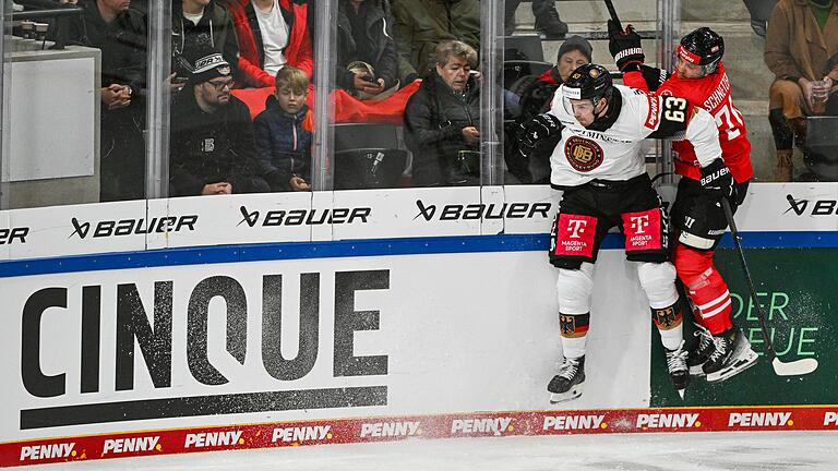 Deutschland - Österreich       -  Harte Zweikämpfe gab es zwischen Deutschland und Österreich beim Deutschland Cup.