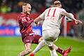 FC Augsburg - RB Leipzig       -  Leipzigs David Raum (l) und Augsburgs Marius Wolf in Aktion.