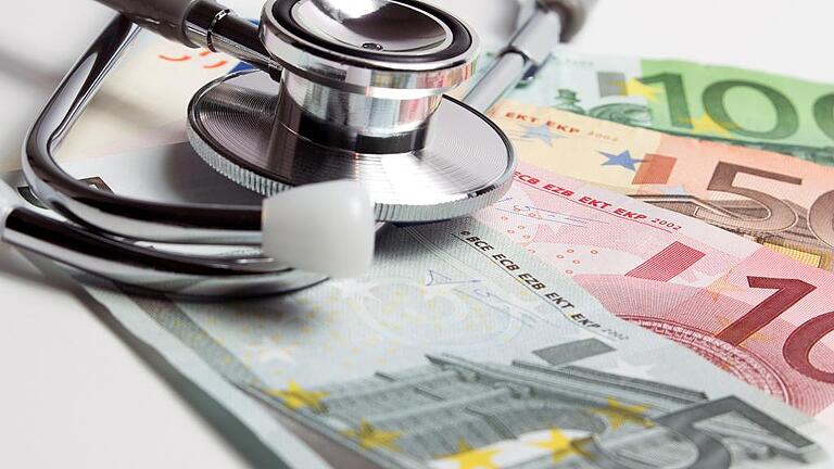 European currency with doctor stethoscope.       -  _