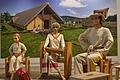 Eine rekonstruierte steinzeitliche Familienszene in der Ausstellung 'Ackern statt Jagen' im Museum für Franken.