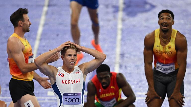 Paris 2024 - Leichtathletik       -  Niklas Kaul (l) ist erster Gratulant bei Leo Neugebauer (r).