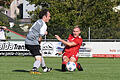 Die Spiele der Kreisliga Rhön       -  Halb im Liegen kommt Schondras Eugen Ortmann noch vor dem Reichenbacher Christian Pickel an den Ball.