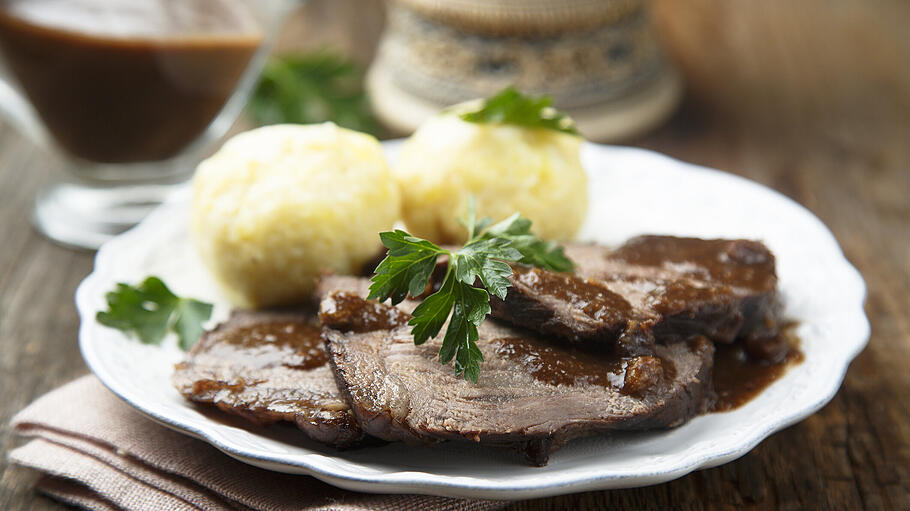 Baked meat with spicy sauce       -  Baked meat or Sauerbraten with spicy sauce and potato dumplings