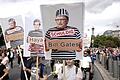 Teilnehmer einer Demonstration gegen die Corona-Maßnahmen halten Schilder mit Fotos von Politikern, Journalisten und Wissenschaftlern jeweils mit Namen und &quot;Schuldig&quot;, rechts Microsoft Gründer Bill Gates.