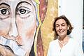 Maria Mesrian, Sprecherin und Aktivistin der Reforminitiative Maria 2.0,&nbsp; neben einem Bild der Muttergottes mit zugeklebtem Mund, gemalt von Lisa Kötter.&nbsp;