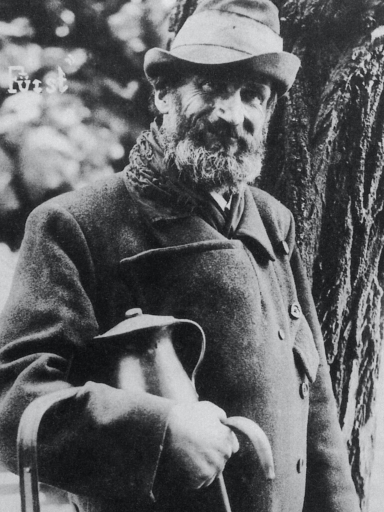 Johann Väth, alias „Raddescher Föschd“, in seiner von einem Strohseil zusammengehaltenen Joppe, mit Stock und Milchkanne.