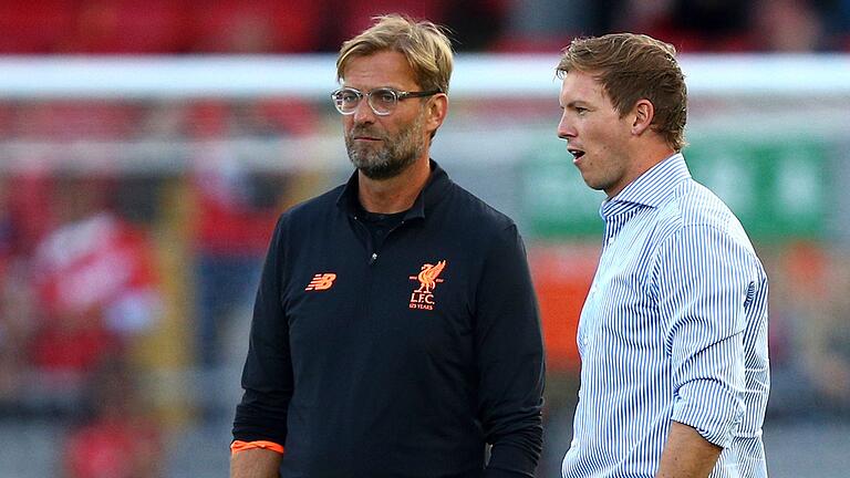 Klopp und Nagelsmann       -  Einst Vereinstrainer, jetzt nicht mehr: Jürgen Klopp und Julian Nagelsmann (r).