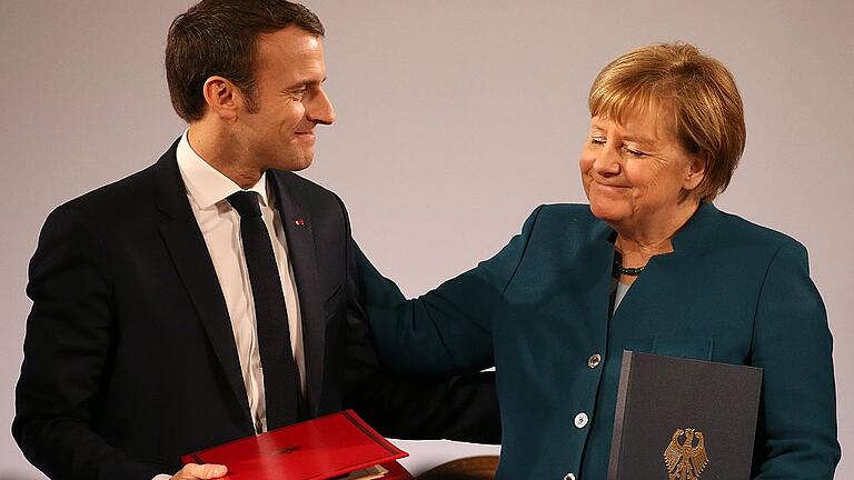 Deutsch-Französischer Freundschaftsvertrag       -  In Aachen haben Kanzlerin Angela Merkel und Staatschef Emmanuel Macron die deutsch-französische Freundschaft erneuert.