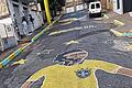 Ein Fußballer-Bild auf Asphalt im Viertel Sagrada Familia in Belo Horizonte. Was von der WM-Euphorie in Brasilien übrig bleiben wird, muss sich erst noch zeigen.
