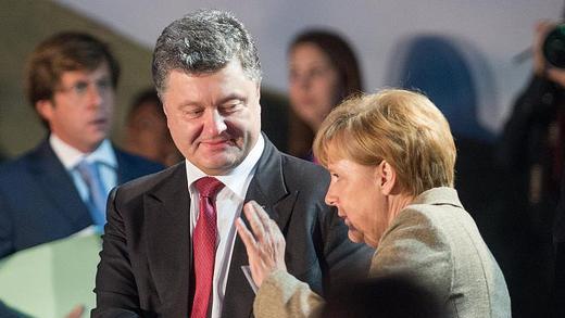 Petro Poroschenko und Angela Merkel       -  Der ukrainische Präsident Poroschenko und Bundeskanzlerin Merkel bei einem Treffen im September dieses Jahres. Foto: Maurizio Gambarini/Archiv