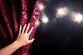 Theater curtain with dramatic lighting       -  _