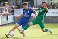 Kevin Steinmann (rechts) vom TSV Abtswind grätscht gegen Fabio Gobbo (links) vom FV 04 Würzburg.