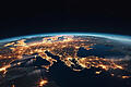 Glowing City Lights: Earth from Space, blue horizon, black sky       -  Lichtverschmutzung auf der Erde