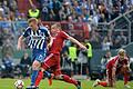 Attacke       -  Karlsruhes Rouwen Hennings (l) wird von Ivica Olic hart angegangen. Foto: Daniel Naupold