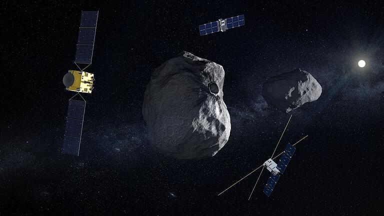 Mission &bdquo;Hera&rdquo; startet zu Asteroid       -  Mission &bdquo;Hera&rdquo; mit Raumsonde (l) und begleitenden CubeSats (oben Milani und unten Juventas) am Doppel-Asteroiden Dimorphos/Didymos.