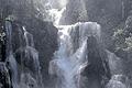 Naturgewalt: Ina Schebler mitten in einem Wasserfall in Laos.