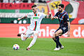 FC Augsburg - 1. FC Heidenheim       -  Augsburgs Jeffrey Gouweleeuw (l) in Aktion gegen Heidenheims Tim Kleindienst.